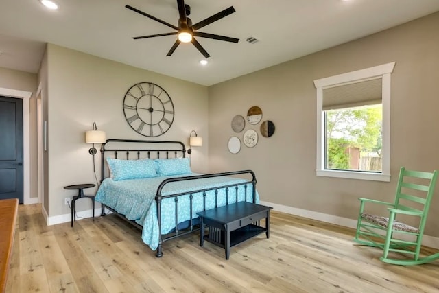 bedroom featuring light hardwood / wood-style flooring and ceiling fan