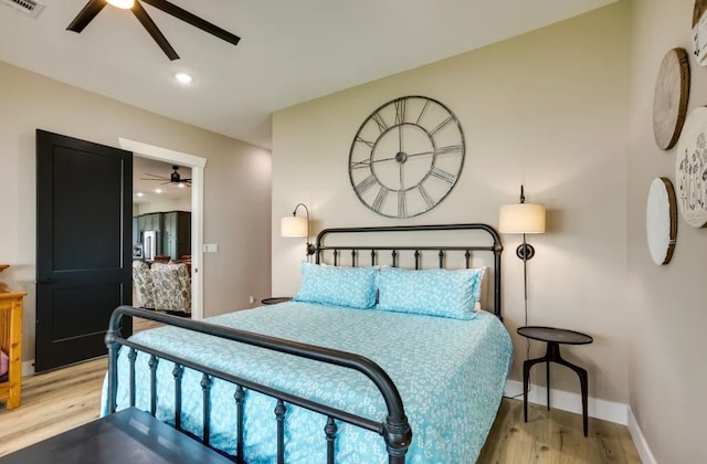 bedroom with ceiling fan and light wood-type flooring