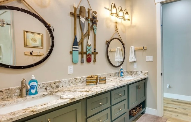 bathroom with hardwood / wood-style floors and vanity