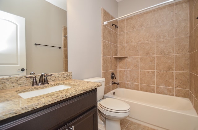 full bathroom featuring vanity, tiled shower / bath combo, toilet, and tile patterned flooring