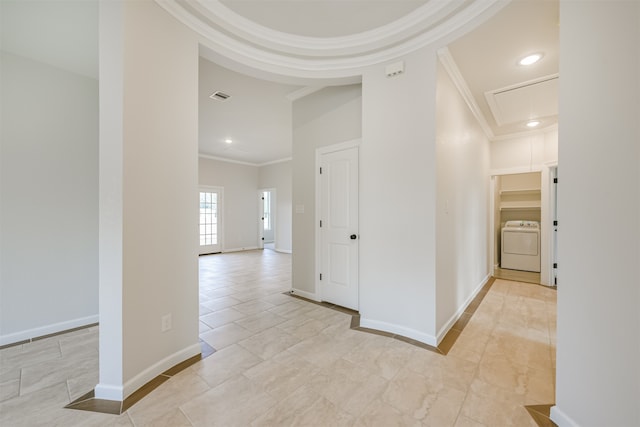 hall with washer / dryer and ornamental molding