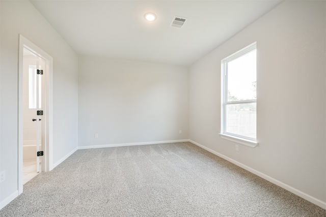 unfurnished room featuring carpet floors