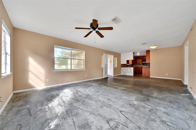 unfurnished living room featuring ceiling fan