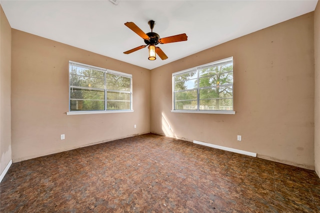 empty room featuring ceiling fan