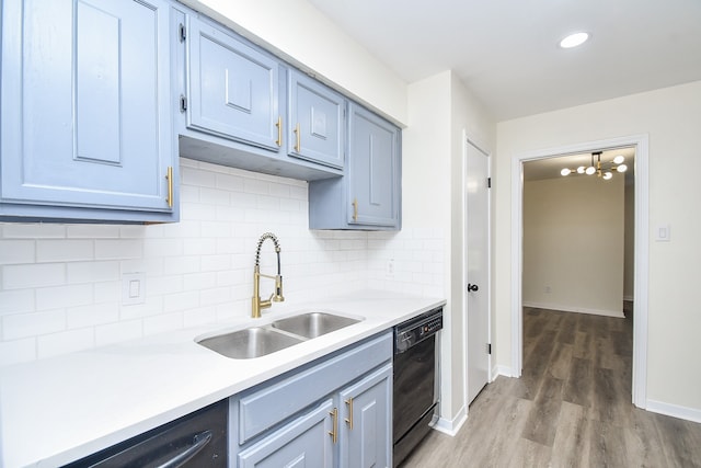 kitchen featuring sink, wood-type flooring, black dishwasher, dishwasher, and decorative backsplash