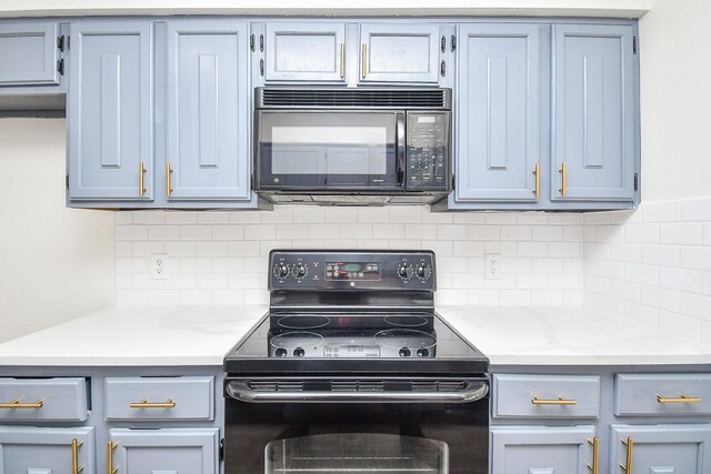 kitchen with black appliances and backsplash