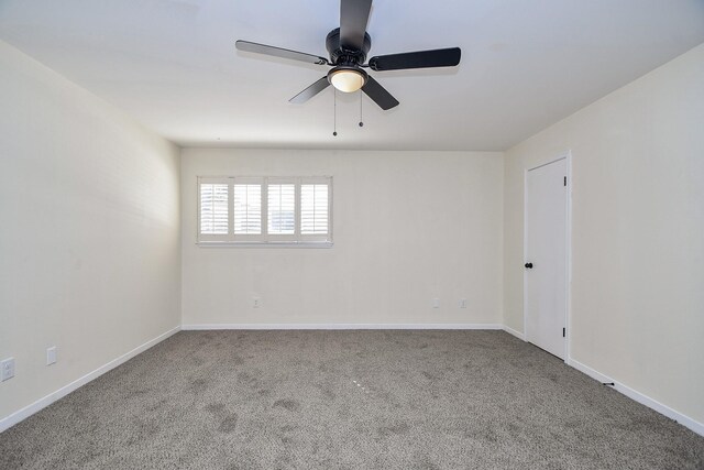 empty room with ceiling fan and carpet floors