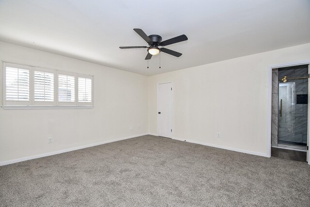 unfurnished room with carpet flooring and ceiling fan