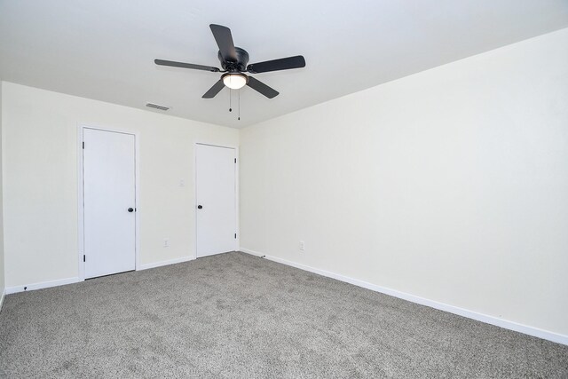 unfurnished bedroom featuring carpet flooring and ceiling fan