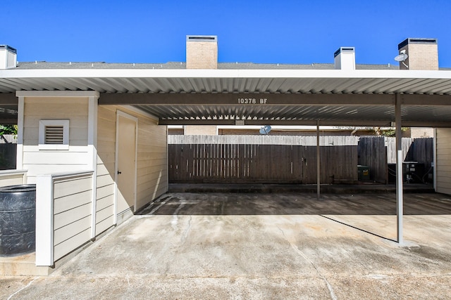 view of vehicle parking featuring a carport