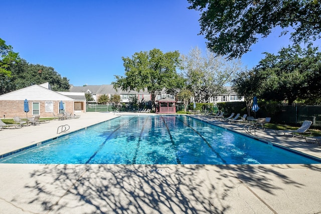 view of swimming pool featuring a patio area