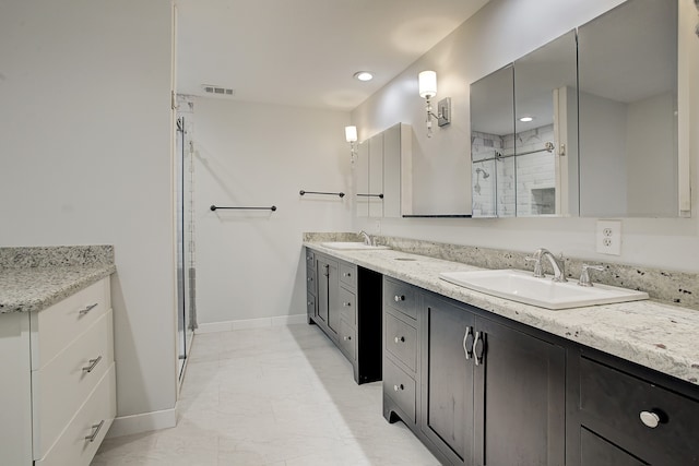 bathroom with vanity and walk in shower