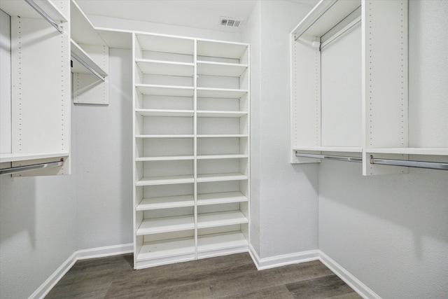 walk in closet featuring dark hardwood / wood-style flooring