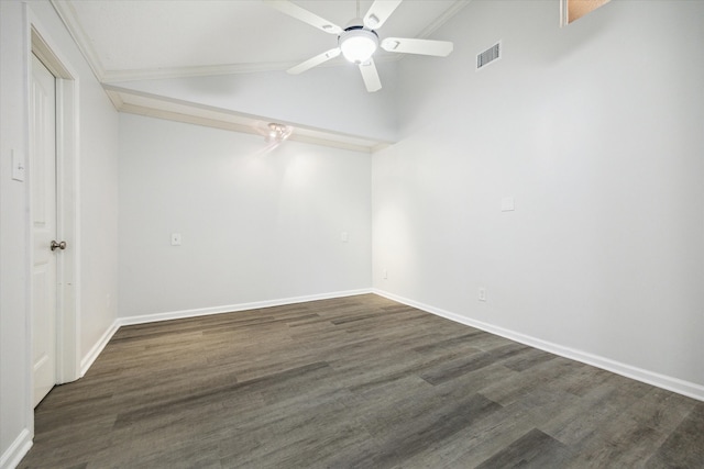 empty room with ceiling fan, crown molding, dark wood-type flooring, and lofted ceiling