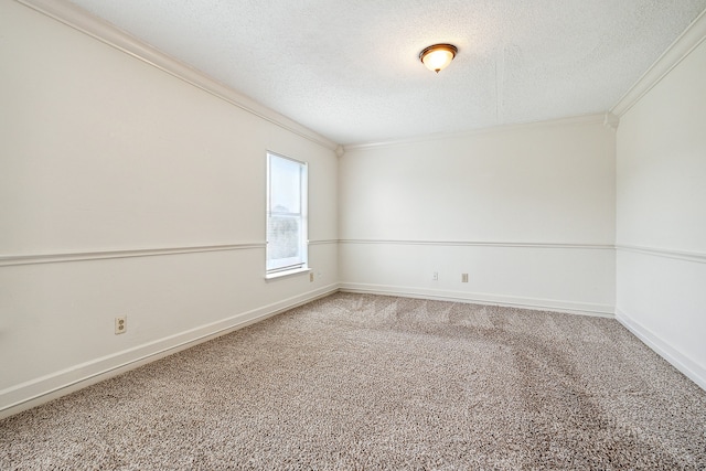 carpeted spare room with crown molding and a textured ceiling