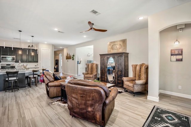 living room featuring ceiling fan