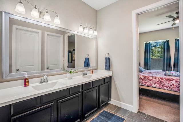 bathroom featuring tile patterned floors, ceiling fan, and vanity