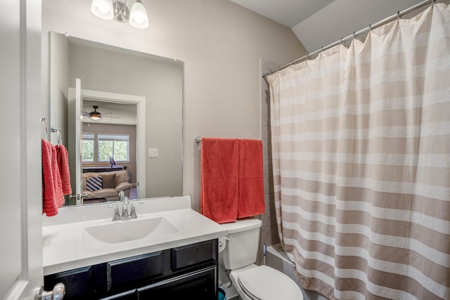 full bathroom featuring ceiling fan, toilet, shower / tub combo, vanity, and vaulted ceiling