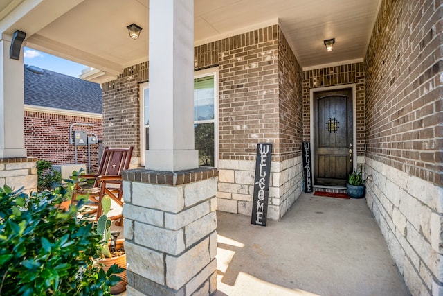 property entrance with covered porch