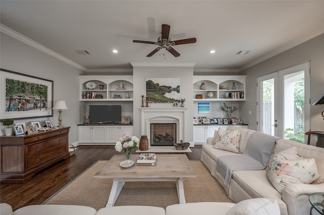 living room with crown molding, dark hardwood / wood-style flooring, ceiling fan, and french doors