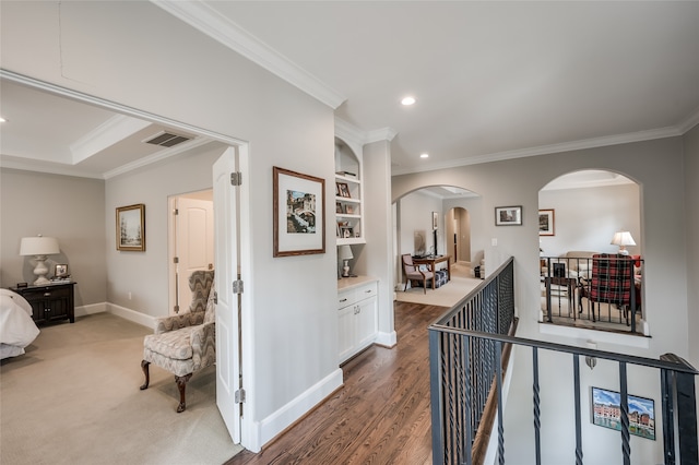 hallway featuring dark hardwood / wood-style flooring and ornamental molding