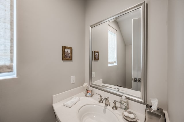 bathroom with vanity and a healthy amount of sunlight