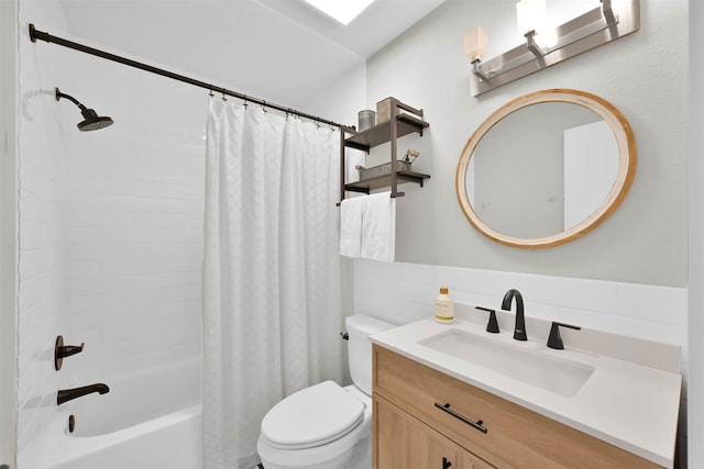 full bathroom with shower / bath combo, vanity, and toilet