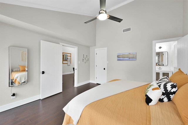 bedroom featuring ceiling fan, dark wood-type flooring, high vaulted ceiling, and ensuite bath