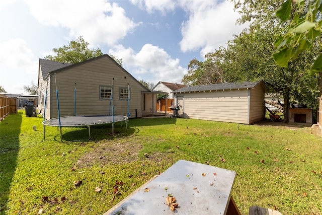 exterior space with a patio, a trampoline, a storage shed, and central air condition unit