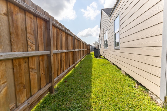 view of yard with central AC