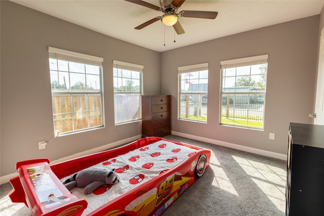 carpeted bedroom with ceiling fan