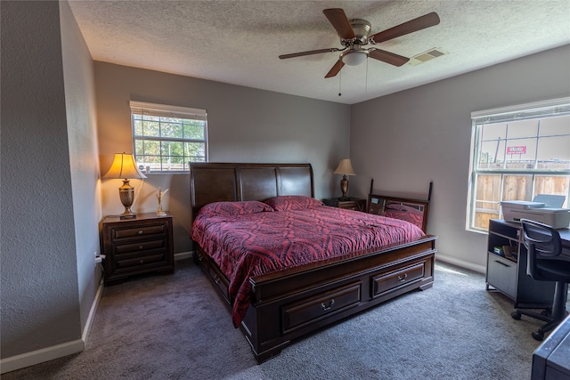 bedroom with carpet, a textured ceiling, and ceiling fan