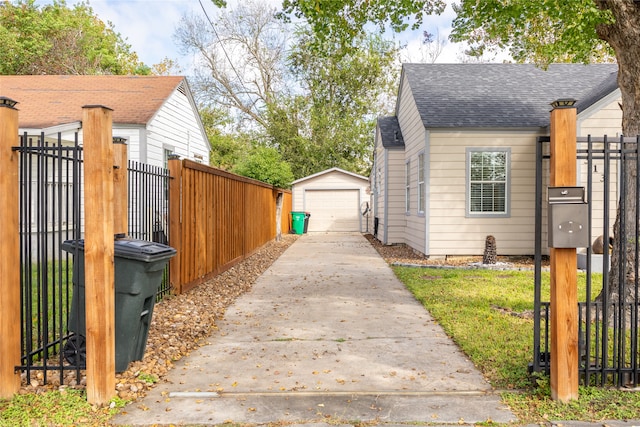 view of property exterior featuring a garage and an outdoor structure