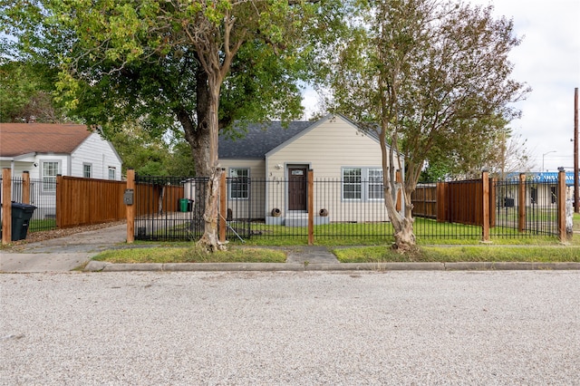 bungalow-style house featuring a front yard