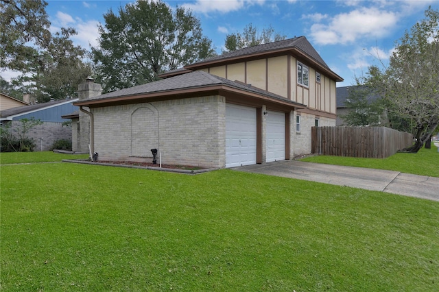 view of home's exterior with a lawn and a garage