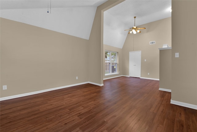 unfurnished living room featuring ceiling fan, dark hardwood / wood-style flooring, and high vaulted ceiling