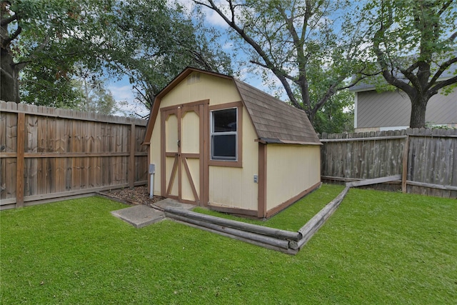 view of outdoor structure featuring a lawn