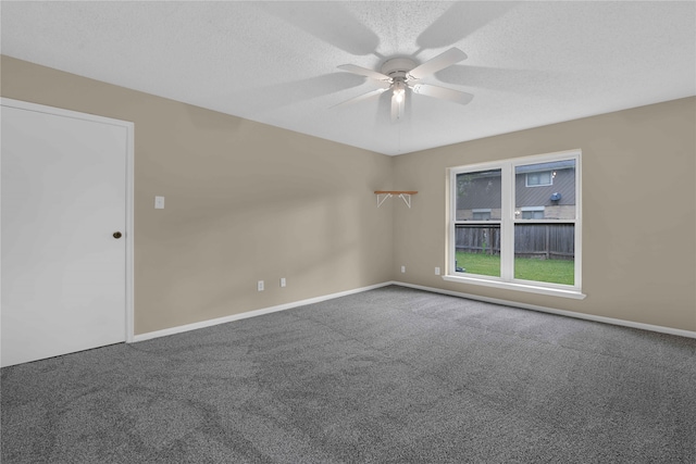 unfurnished room with a textured ceiling, carpet floors, and ceiling fan