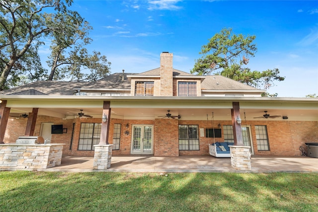 back of property with a patio, ceiling fan, and exterior kitchen