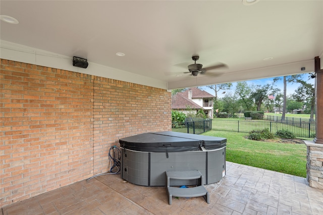 view of patio featuring a hot tub and ceiling fan