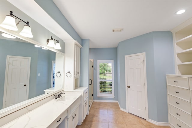 bathroom with vanity and tile patterned floors