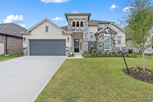 view of front of house with a front yard and a garage