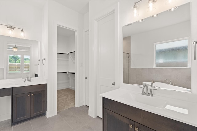 bathroom featuring ceiling fan, tile patterned flooring, and vanity