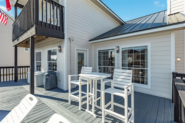 wooden terrace featuring area for grilling