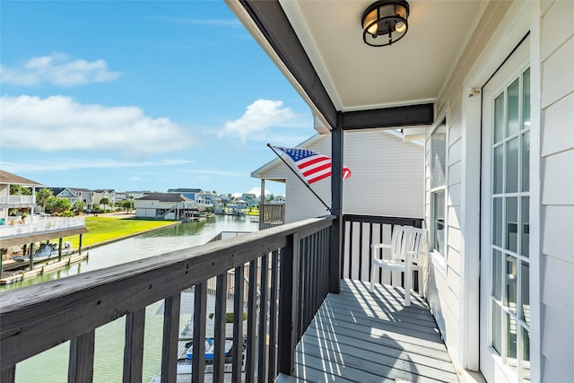 balcony featuring a water view