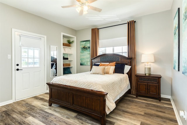 bedroom with hardwood / wood-style flooring and ceiling fan