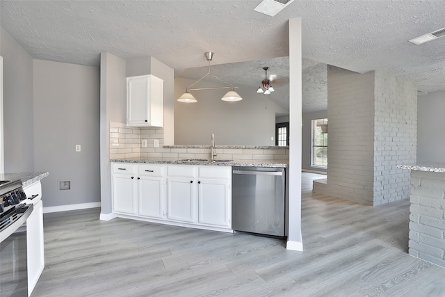 kitchen featuring white cabinetry, sink, hanging light fixtures, stainless steel appliances, and light hardwood / wood-style flooring