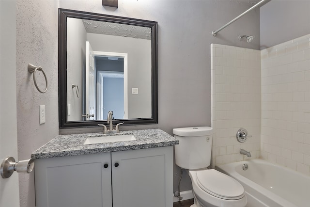 full bathroom featuring vanity, toilet, and tiled shower / bath