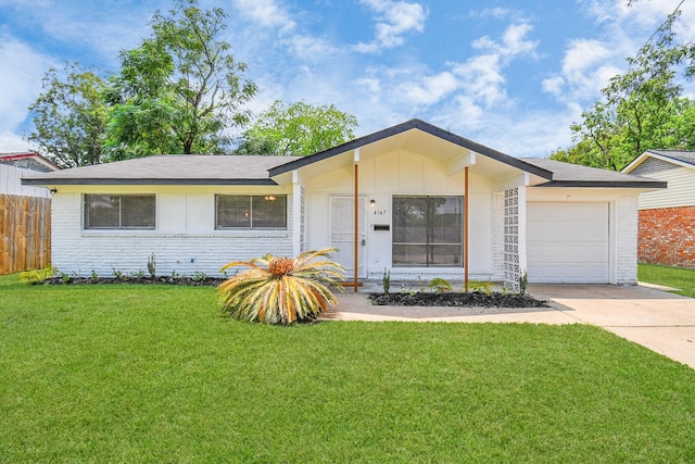 single story home featuring a front lawn and a garage