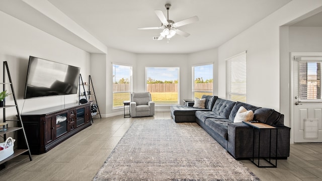 living room featuring ceiling fan and light wood-type flooring